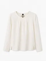 Remera de manga larga con frente de lino y espalda de algodón con spandex. Presenta cuello redondo con delicadas alforzas en el delantero y aberturas laterales en el ruedo.
