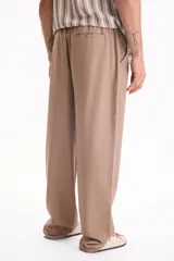 Pantalón de lino con cintura elastizada y cordón ajustable