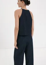 Top de algodón estilo denim con cuello halter y diseño sin mangas.