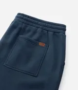 Pantalón de corte recto confeccionado en tejido de algodón y poliéster, con cintura elástica ajustable mediante lazo y bolsillos laterales.