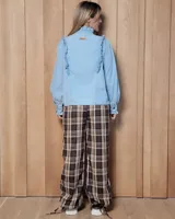 Pantalón de villela de algodón con estampado de cuadros en tonos marrones y beige, de corte holgado con cintura elástica y cordón ajustable, y sistema de ajuste en los tobillos.