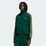 Campera deportiva Adidas Firebird de color verde oscuro con textura de rayas de tiza y detalles en amarillo, incluyendo las clásicas tres tiras en las mangas y el logo del trifolio bordado en el pecho. Cuenta con cuello alto, cierre frontal completo y bolsillos laterales.