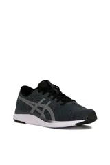 Championes deportivos Asics modelo Streetwise, color azul con diseño melange, suela blanca con detalles en naranja y el logo de la marca en tono rosado en el lateral.