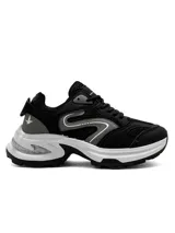 Championes deportivos para mujer Santa Barbara modelo Stride, color negro con detalles en gris y suela chunky blanca.