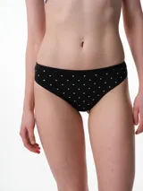 Bombacha tipo colaless de algodón color beige con estampado de pequeños lunares blancos. Presenta un diseño de tiro medio con costuras suaves para mayor comodidad.