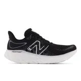 Championes New Balance 1080 para dama, color negro con detalles en blanco, ideales para running.
