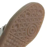 Championes Adidas Sambae W, color negro con las tres tiras blancas y suela marrón de goma.