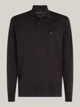 Chomba de manga larga Tommy Hilfiger color negro, confeccionada en algodón. Presenta cuello tipo polo, tapeta de dos botones y logo bordado en el pecho.