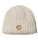 Gorro de lana tejido en punto acanalado con vuelta, color beige, con parche circular de la marca Columbia en el frente.