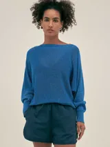 Short blanco de tejido seersucker de algodón con cintura elastizada, bolsillos laterales y detalle de logo Polonio en cobre.