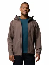 Campera cortaviento impermeable y transpirable Columbia Trailborne 2.5L color marrón, con capucha integrada, cierre frontal bidireccional y bolsillos con cierre.
