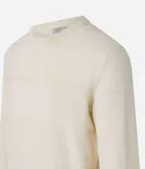 Buzo azul marino de algodón texturizado, con cuello redondo y mangas largas con puños ajustados.