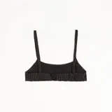 Top tipo bralette de denim lavado color marrón, con breteles finos, elástico en la espalda y bordado frontal con logo.