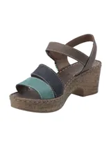 Sandalia de plataforma con suela efecto corcho, con tiras de cuero en colores marrón, azul marino y verde agua, y cierre de velcro en el tobillo.