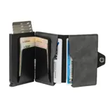 Billetera de cuero genuino y aluminio color negro, modelo Kansas Zipper Space de la marca Baleine. Cuenta con un tarjetero de aluminio con sistema de deslizamiento para tarjetas, protección RFID, compartimento para billetes y cierre con botón a presión.