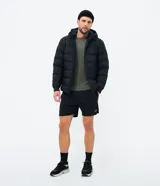 Remera deportiva de manga larga para hombre, color gris melange, con cuello redondo y tecnología dry con protección UV.