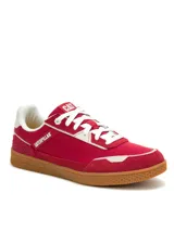 Sneakers Caterpillar modelo Pause Retro Canvas, de color rojo con detalles en blanco y suela de goma marrón.