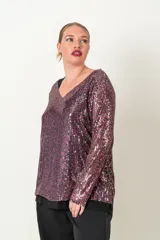 Blusa de fiesta con lentejuelas plateadas y verde esmeralda, forrada en viscosa, con escote en V y mangas tres cuartos.