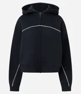 Saco con capucha de Blue Steel, confeccionado en mezcla de algodón y poliéster. Presenta cierre frontal con cremallera, puños y ruedo acanalados, y detalle de piping blanco en contraste en el pecho y las mangas.