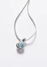 Cadena omega italiana de plata 925 con dije redondo con topacio azul.