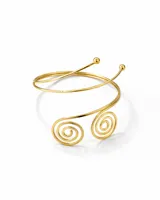 Brazalete metálico dorado para la parte superior del brazo, con diseño de espirales en la parte inferior y extremos con esferas.