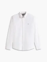 Camisa de corte regular fit confeccionada en tejido twill técnico de nylon y elastano. Presenta cuello clásico, cierre frontal con botones y el logo de la marca bordado en el pecho.
