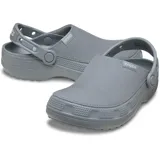 Zuecos Crocs modelo Classic Crafted Clog, de color beige, con parte superior de lona textil y suela de goma Croslite. Incluye correa de talón pivotante y detalles de la marca en el lateral.