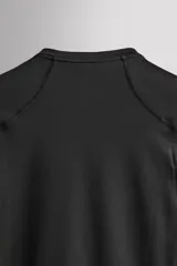 Camiseta técnica de manga larga Zara Athleticz, color marrón, de ajuste slim fit con cuello redondo y costuras decorativas.