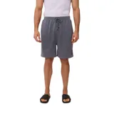 Bermuda gris de algodón con cintura elástica ajustable con cordón y logo estampado en la pierna derecha.