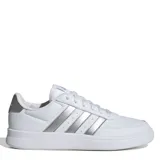 Championes Adidas Breaknet 2.0 de estilo urbano, color blanco con las icónicas tres tiras laterales y detalle en el talón en color plateado metalizado. Presentan un diseño de corte bajo con cierre de cordones y suela de goma plana.