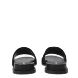 Sandalias planas tipo slide marca Bottero, color negro, con banda ancha superior de textura aterciopelada y suela de goma.