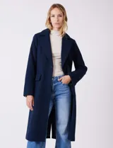 Tapado largo de lana Michael Kors, de corte recto y silueta estructurada. Presenta cuello con solapas amplias, cierre frontal con botones y bolsillos laterales con tapa. Incluye forro interno a tono.