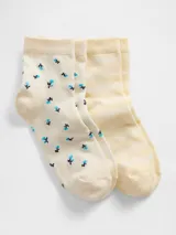 Pack de dos pares de medias de caña media. Un par color crema con estampado de pequeñas flores azules y negras, y otro par color amarillo claro con textura jaspeada.