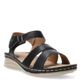 Sandalias de mujer con tiras de cuero sintético negro, una de ellas con textura grabada, cierre con velcro en el tobillo y suela de plataforma baja en color beige con costuras decorativas.