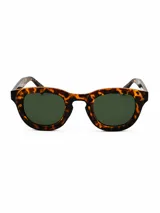 Lentes de sol Milan con armazón carey en tonos marrones y caramelo, de diseño redondo y clásico, con cristales oscuros.