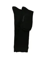 Medias largas de caña alta color negro, con diseño acanalado especial para botas, confeccionadas en mezcla de bambú y spandex.