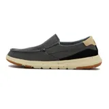 Zapato casual tipo slip-on de color gris oscuro, con detalles elásticos laterales para fácil calce, suela clara con efecto salpicado y refuerzo negro en el talón con la inscripción Country.