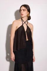 Top reversible verde oscuro de jersey elastizado, con diseño suelto y fluido, escote halter y tiras cruzadas en el cuello.