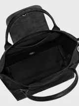 Cartera de mano modelo Le Pliage One tamaño S, confeccionada en nylon negro con detalles en cuero. Presenta cierre superior con solapa y botón a presión característico de la marca.