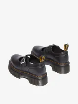 Zapato mocasín negro de cuero Nappa Lux con plataforma Quad Neoteric, suela con tacos profundos y pespunte amarillo.