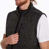 Chaleco de polar gris jaspeado con cierre frontal, bolsillo en el pecho con cierre y bolsillos laterales con cierre e interior de polar.