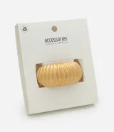 Pulsera rígida de metal con baño de oro envejecido, diseño de superficie con relieve y efecto plegado.