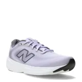 Championes de running New Balance modelo 411, color lila con detalles en gris y suela blanca con refuerzo negro en la puntera. Presentan el logo N característico en los laterales y cierre mediante cordones.