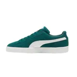 Championes Puma modelo Suede Classic, confeccionados en gamuza de color negro con la icónica franja lateral en blanco y el logotipo de la marca impreso en dorado metalizado en el lateral. Suela de goma texturizada en color blanco.