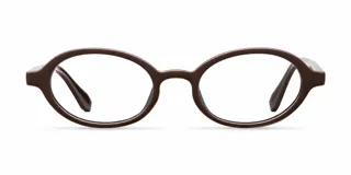 Lentes de lectura con montura ovalada de color marrón oscuro, fabricada en material bio-based y patillas de propionato de celulosa. Presentan un diseño clásico y minimalista con acabado pulido.