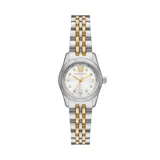Reloj de pulsera Michael Kors modelo Lexington con caja de 26 mm, esfera plateada con índices de cristal y número romano a las 12, y malla de acero inoxidable bicolor en tonos plateado y dorado.