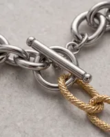 Pulsera de eslabones gruesos de acero italiano, con eslabones centrales texturizados en baño de oro.
