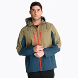 Campera impermeable tipo hardshell de Merrell, con diseño bicolor en tonos beige y azul. Cuenta con capucha ajustable, cierre frontal completo, bolsillos con cremalleras impermeables en contraste naranja y ventilación en las axilas.
