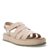 Sandalias de plataforma tipo jaula con tiras anchas de material sintético en color blanco hueso, cierre de velcro en el tobillo y suela de goma negra con base color caramelo.