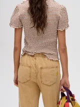 Pantalón de jean color gris oscuro con efecto acid wash, corte relajado y recto, con cintura elástica y cordón ajustable.